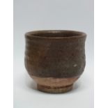 TREVOR CORSER (1938-2015) An ash glazed yunomi Impressed potter's mark and St Ives Pottery mark