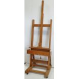 A pine artist's adjustable easel, height 224cm