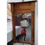 19th century pier mirror - An inverted breakfront top with half column to sides and ornate moulding,
