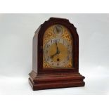 Circa 1900 mantle clock - A stained oak cased timepiece with slow/fast dial to top and silvered