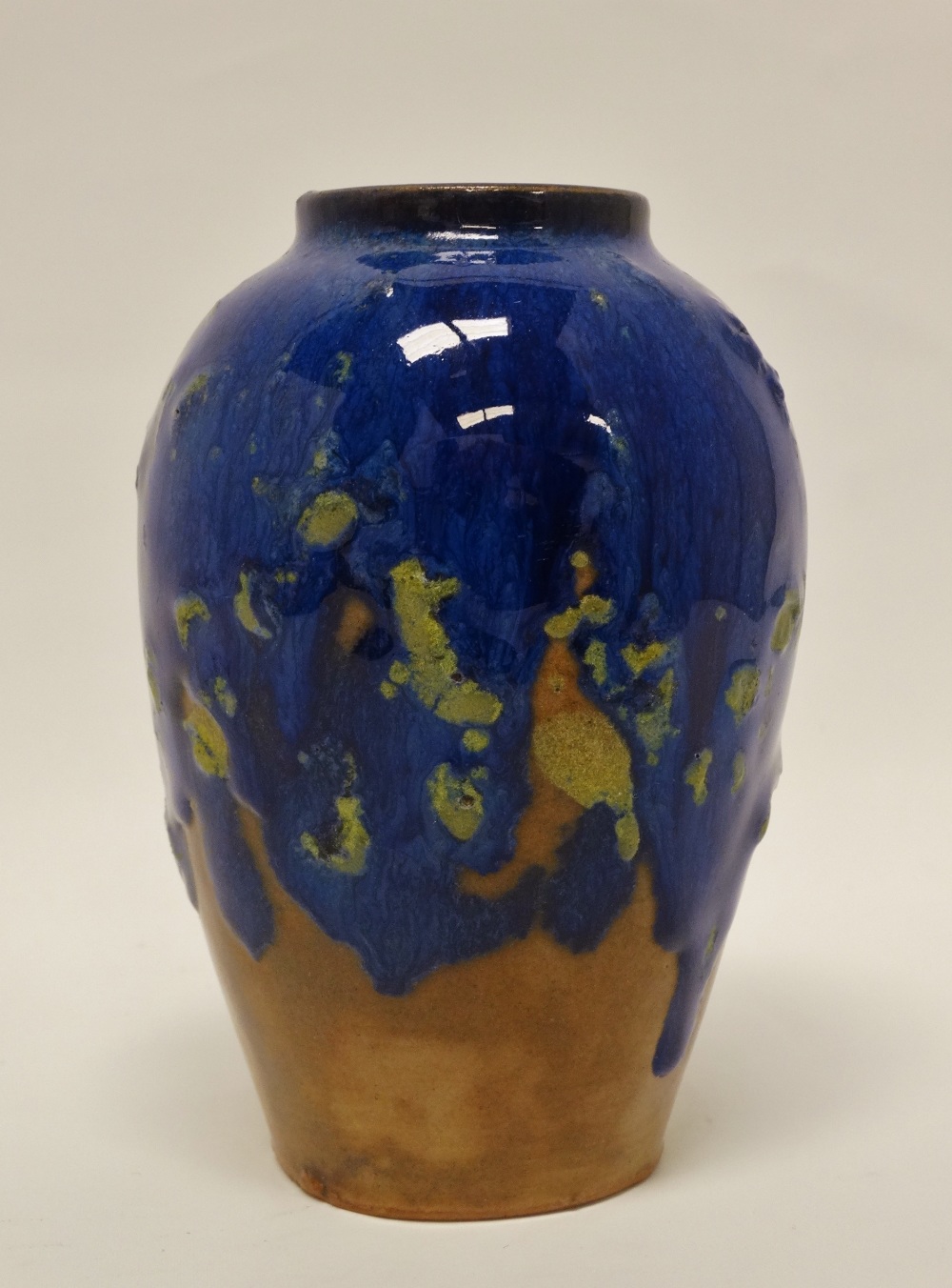 Atelier D'Art Labrec - A bullet shaped short vase with drip glaze enamel decoration, stamped to