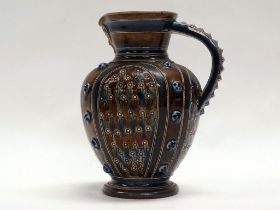 Doulton Lambeth - An 1871 glazed and prunt decorated jug with mask under spout, height 14.5cm,