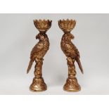 Parrots - A pair of carved wooden gilded candlesticks modelled as parrots on branches with leaf
