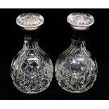 Silver collared decanters - A pair of cut lead crystal decanters with slab cut shoulders and star