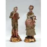 A pair of 18th century style figures - Two Worcesteresque signed figures of a lady and a gentleman