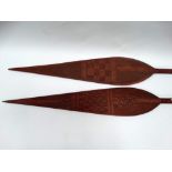 Ethnographic Native Tribal - A pair of early 20th century hand carved ceremonial paddles of spear