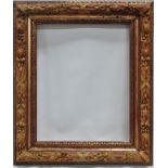 A mid XX relief and gilt frame - An unusual ribbon, laurel and oak frame with gilt egg and dart