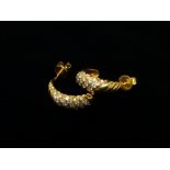 18ct gold and diamond earrings - A pair of 18ct gold half hoop diagonally reeded earrings set
