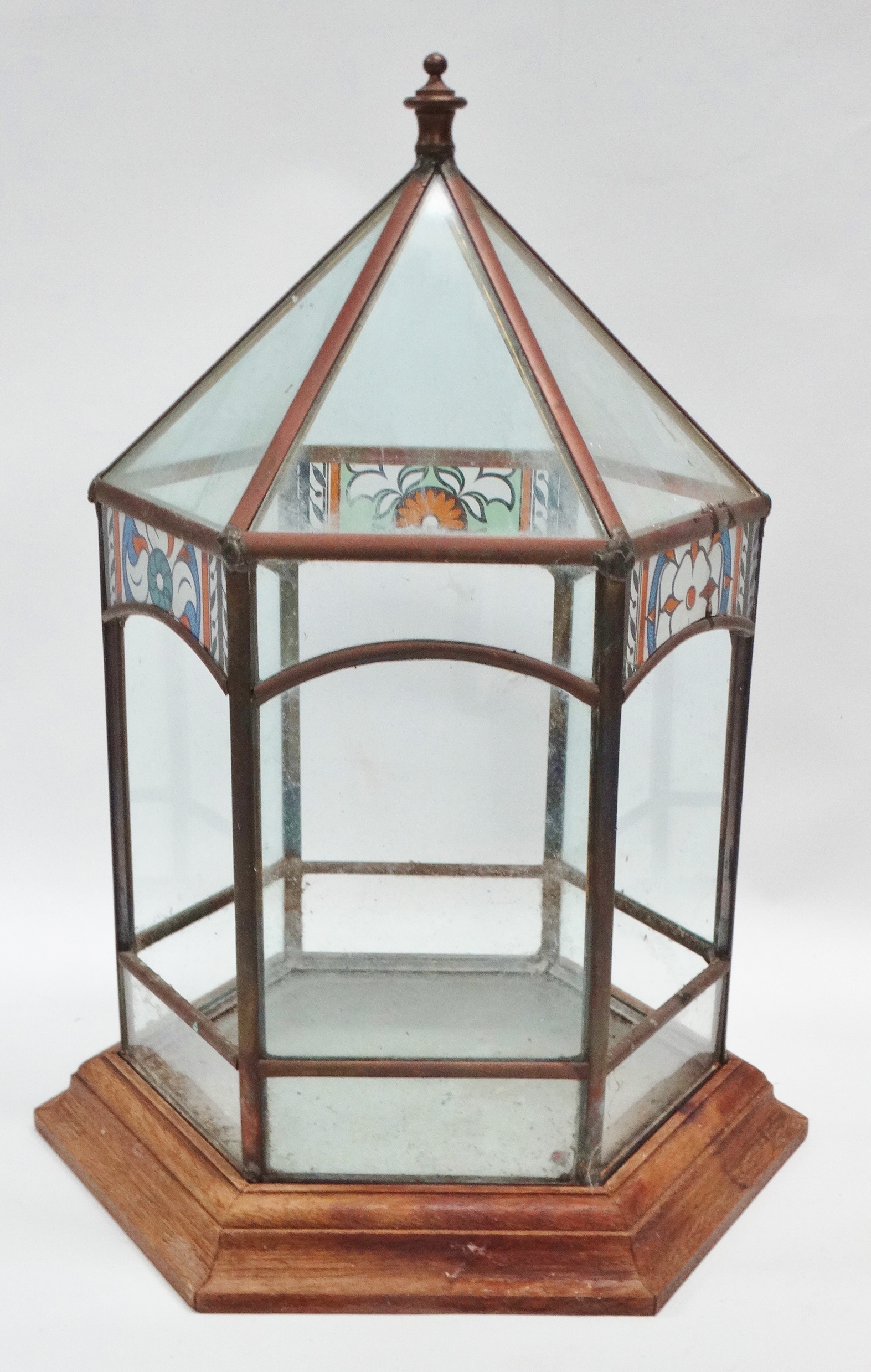 Terrarium - An early 20th century hexagonal glazed, stained glass and copper terrarium on an oak