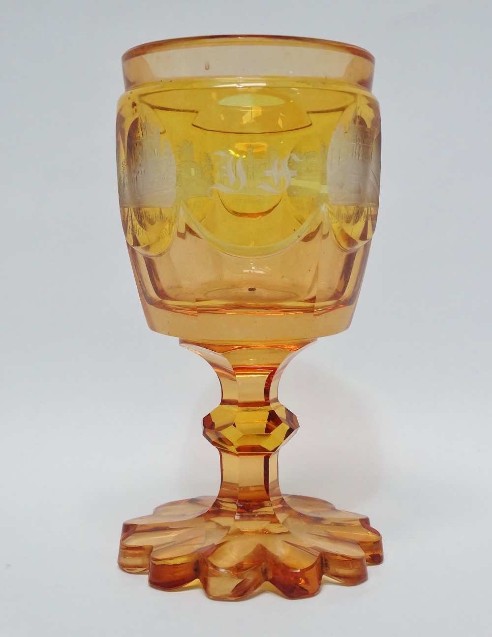 Bohemian Glass - An amber pedestal goblet with flush cut vignettes of Chateau d'Eberltein and four