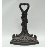 19th century doorstop - A black painted cast iron door porter in the form of acanthus on a shaped