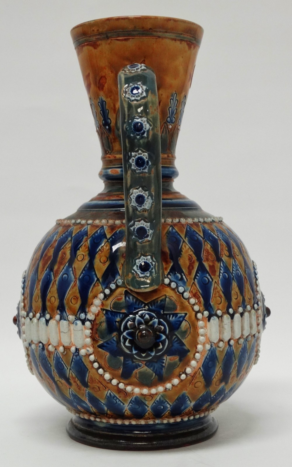 A Doulton Lambeth 1880 - A pot bellied jug glazed and decorated in bas relief, stamped HW and - Image 4 of 6