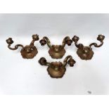 Brass wall branches - A set of four twin branch brass double veloupe electric wall sconces, height