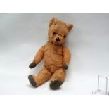 Early 20th century mohair teddy bear - Jointed arms, legs and neck, hump to back, centre stitched