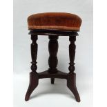 Victorian piano stool - A mahogany overstuffed seated, adjustable height, three legged piano