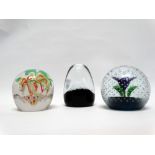 Glass paperweights - Three paperweights, two marked C11G, largest height 8cm.