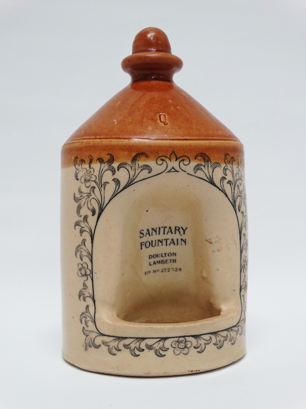 Doulton Lambeth - A two part salt glazed flagon shaped vessel, printed 'Sanitary Fountain' Rd No.