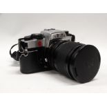 A Leica R5 35mm s.l.r. camera in chrome finish, Nr 1720304, with Leica Vario-Elmar-R 28-70mm f 3.5 -