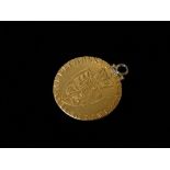 A 1791 Spade Guinea coin - A George III gold guinea, obverse Fifth laureate head right, legend reads