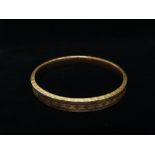 9ct gold bangle - An HG & S 9ct gold bangle with hollow centre, diameter 7.9cm, weight 14g.