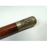 MILITARIA - A walking stick with regimental insignia for The Royal Irish, length 86.5cm.