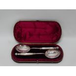 Silver plate cased serving spoons - A leather cased and gilt line decorated, purple silk and