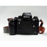 A Nikon F4 s.l.r. camera body, No. 2279924 with instructions.