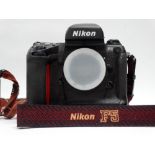 A Nikon F5 s.l.r. camera body, No. 3068758 with instructions.