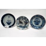 18th/19th century Chinese saucers - A blue and white plate decorated with an urn of flowers, hand