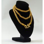 A Thai gold four link necklace of plaited form, with ornamental decoration to ends, length 66.7cm,