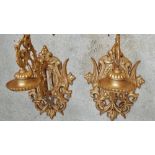 Wall hanging pricket brackets - A pair of cast iron wall mounted candle stands, height 60cm.