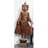 A large Tibetan gilded wooden figure, height 175cm, width 74cm.