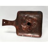 Newlyn Copper - A large chamberstick repousee decorated with four fish, height 5cm, width 19cm,
