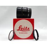 A Leitz Canada Summicron-R 90mm f2 lens in black finish, with u.v. filters, caps, and maker's box.