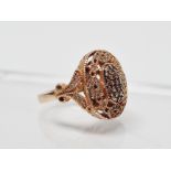 14ct gold and diamond ring - A pave set ring with a pierced and shaped top and shaped shoulders,