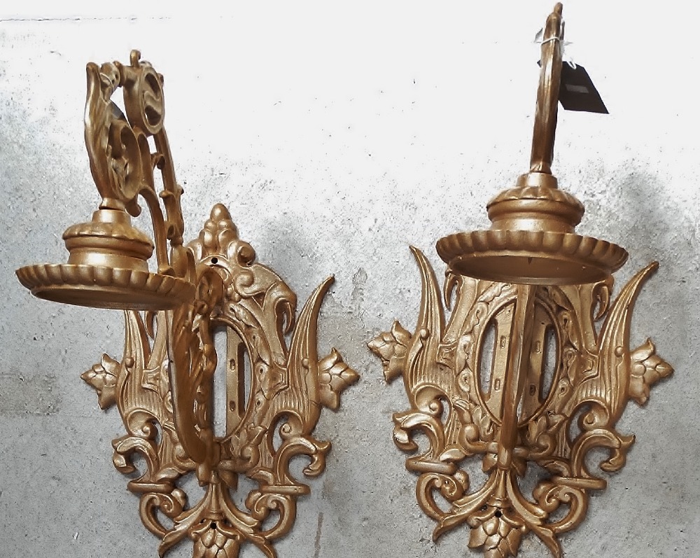 Wall hanging pricket brackets - A pair of cast iron wall mounted candle stands, height 60cm.