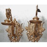 Wall hanging pricket brackets - A pair of cast iron wall mounted candle stands, height 60cm.