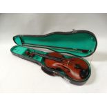 Violin - A circa 1900 four string violin with one piece back and inlaid with double stringing,