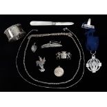 Assorted silver and white metal items - An Arms of Traverseiet brooch, a mother of pearl handled