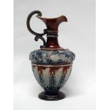 Doulton Lambeth Art Union Of London - A baluster shaped ewer with double veloupe handle with bas and