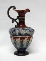 Doulton Lambeth Art Union Of London - A baluster shaped ewer with double veloupe handle with bas and