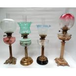 19th century oil lamps - Four assorted column oil lamps, three brass, one alabaster, two clear and