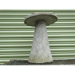 Three reconstituted stone mushrooms, largest height 60cm, diameter 38cm.