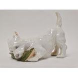 Royal Copenhagen - A West Highland terrier playing with a slipper, No.3776, length 11.5cm.