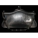 A silver plated dress purse on chain with engine turned striped decoration to one side, width