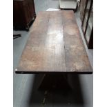 Designer kitchen table - A walnut planked top table standing on an X framed pair of trestles