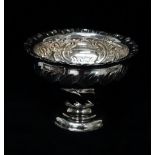 A silver pedestal sugar bowl with C scroll embossing and vacant cartouche, Sheffield 1927, maker's