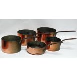 Copper saucepans - Circa 1900 a matched collection of five graduated saucepans with riveted handles,