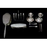 A quantity of silver, to include a four sectional toast rack, Sheffield 1934, maker's mark for