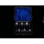 Art Nouveau - A set of six silver teaspoons with tendril decoration to the terminals and shaft,